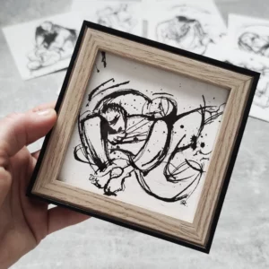 a hand holding a picture frame