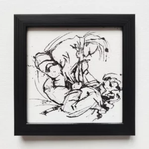 a black framed picture of a woman holding a baby