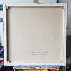 a white canvas on a wooden stand