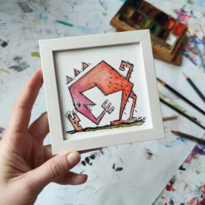 a hand holding a picture of a dog