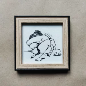 a framed picture of a person hugging