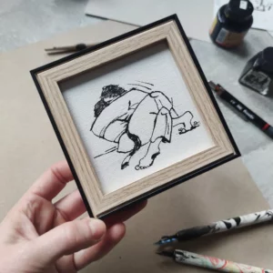 a hand holding a picture of a person